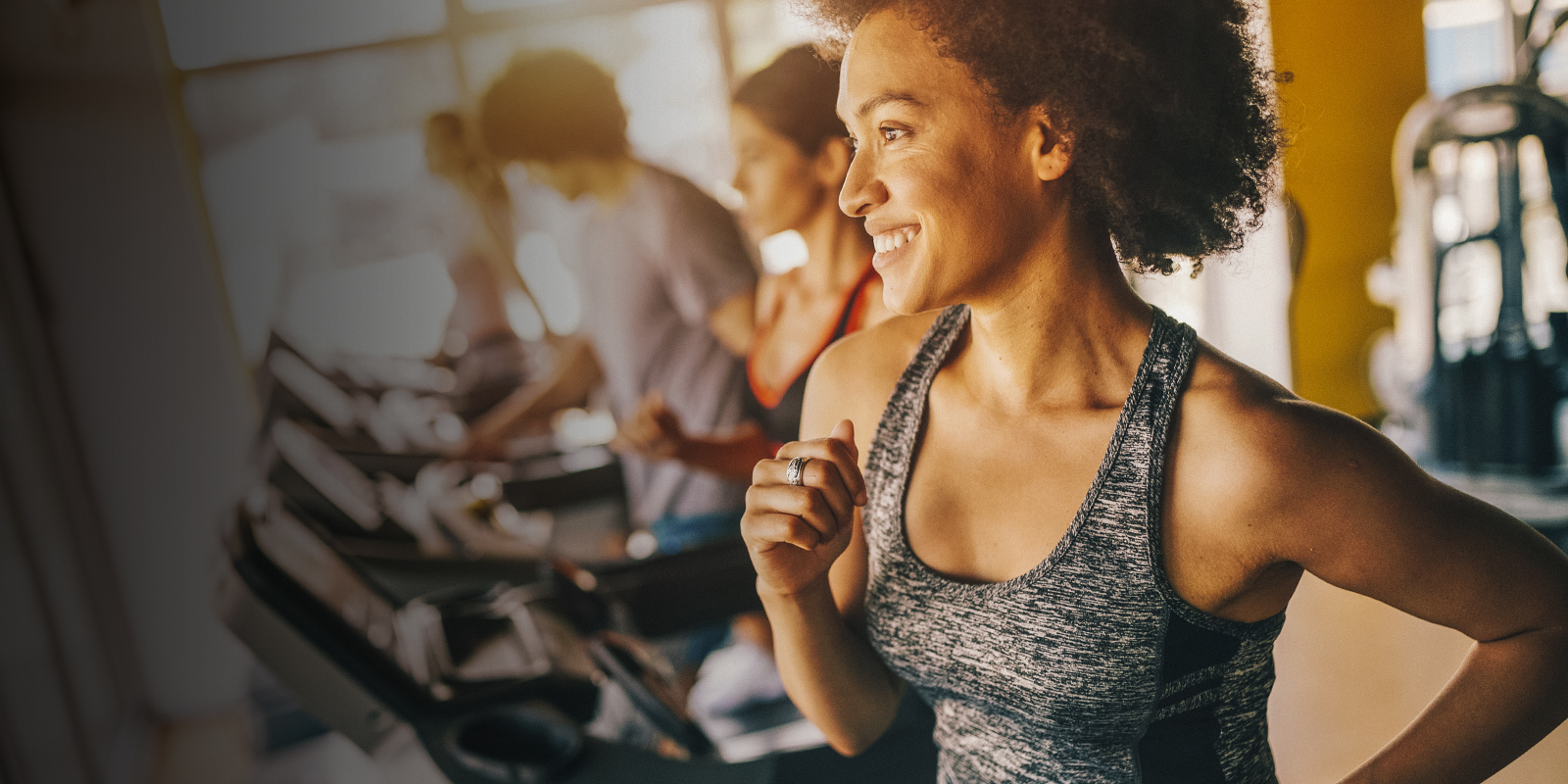 A woman runs on a treadmill